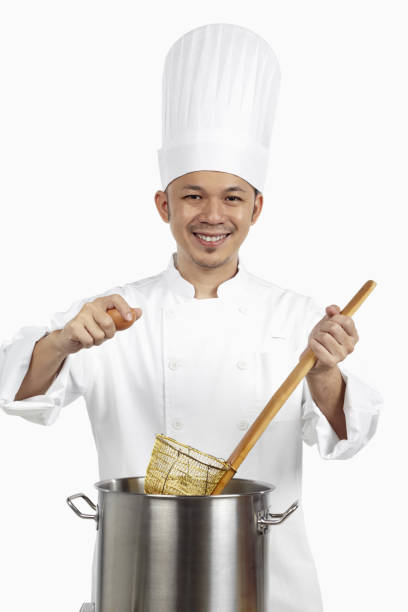 istock Asian chef preparing noodles 1267473156