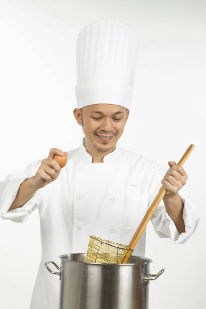 istock Asian chef preparing noodles 1267473525