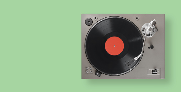 Turntable is playing vinyl LP record top view. Clipping path.