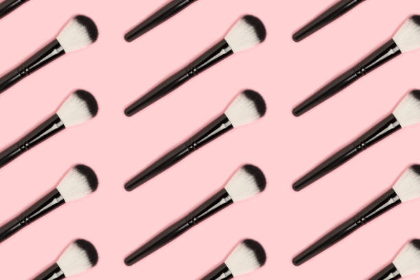 istock Repetitive pattern made of black makeup brushes. 1267476508