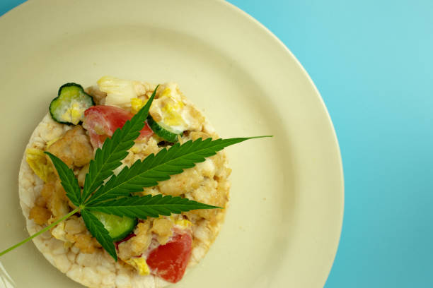 istock Marijuana Weed leaf on healthy food plate top view with copy space 1267479213