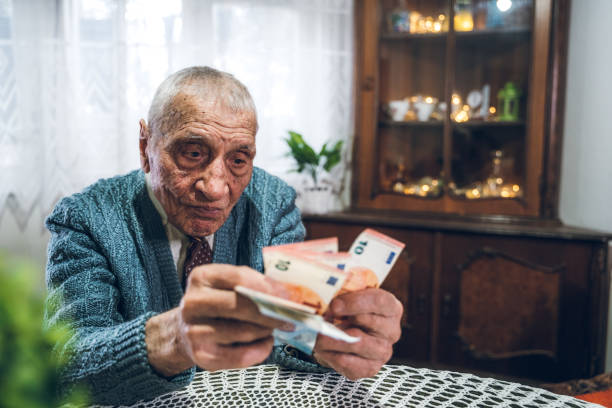 istock Senior man holding euros 1267479418