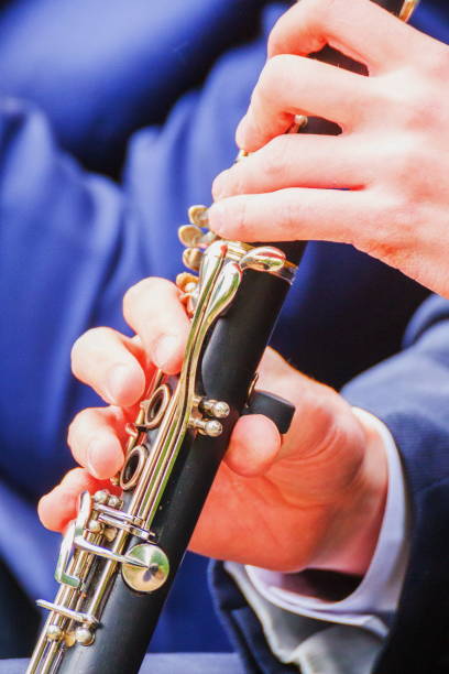 istock Hands of a musician play a clarinet 1267479624