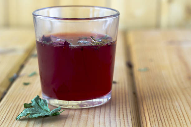 istock Red hibiscus tea in a glass cup 1267480219