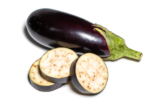 eggplant or aubergine and parsley leaf on white background.