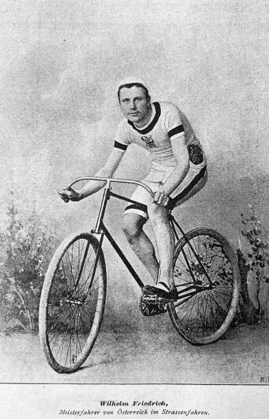 Cyclist Wilhelm Friedrichs, Austrian champion in road cycling, front view, sitting on bicycle Illustration from 19th century penny farthing bicycle stock illustrations