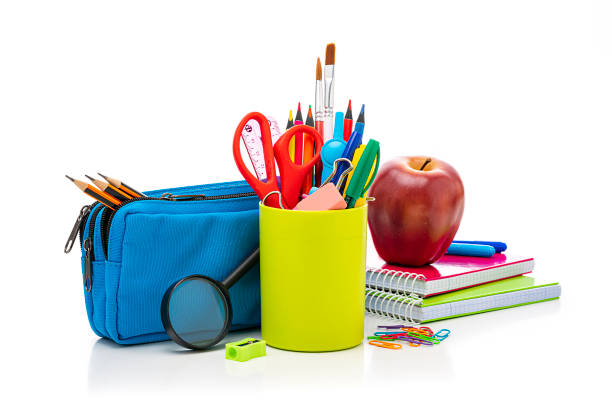 istock Desk organizer filled with some office or school supplies on white backdrop 1267481490