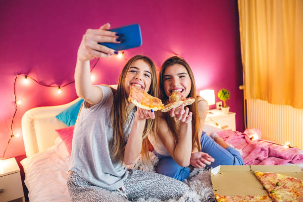 Eating pizza at slumber party