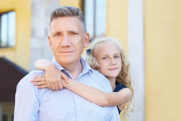 Father and daughter. Embrace. Portrait.