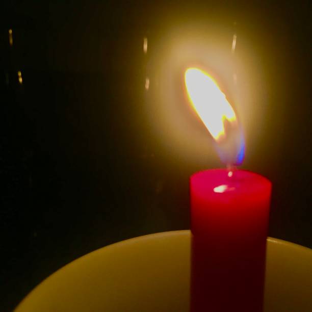 istock Red candle in the dark 1267489427