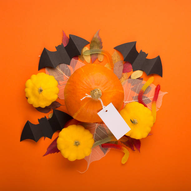 istock Halloween paper decorations on orange background. 1267489566