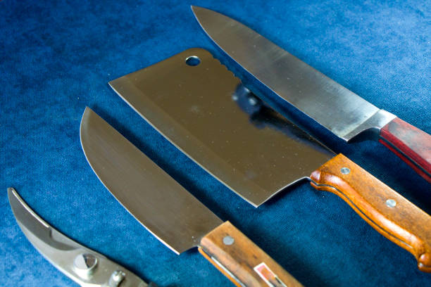 istock Kitchen knives collections on the blue background, tools and instruments for cooking. 1267489991