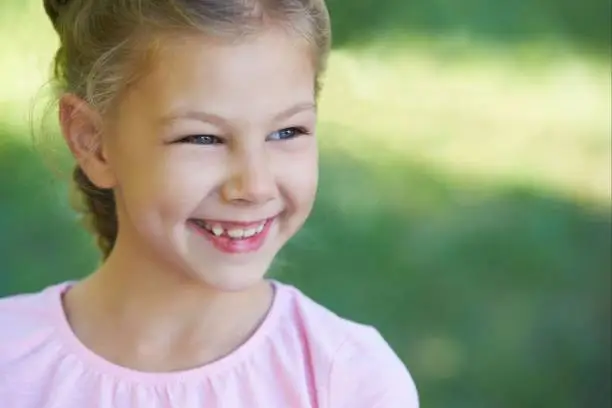 Portrait of a girl. Happy child. Smile.