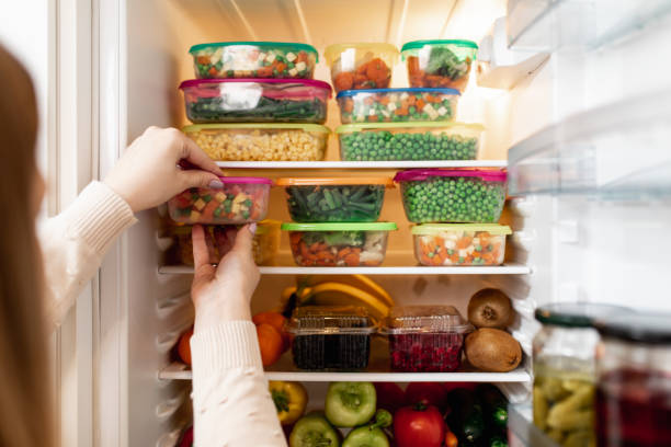 istock Woman taking raw food from refrigerator 1267490957