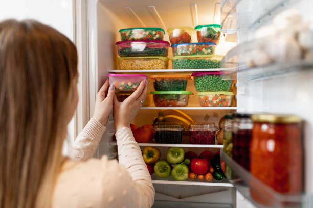 istock Woman taking raw food from refrigerator 1267490974