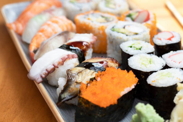 Hawaii Japanese sushi dishes. Roll with maki and tuna, salmon, shrimp, crab and avocado. Various sushi Top view all you can eat menu. Rainbow sushi, uramaki, hosomaki and nigiri.