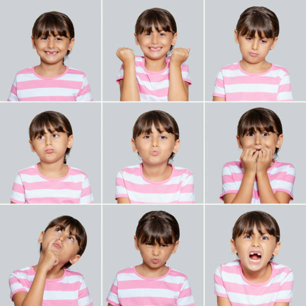 istock Cute little girl making different face expressions, Studio shot 1267492139