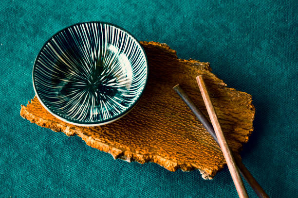istock Empty Asian dishware, bowl, pate and chopsticks on the blue background, restaurant tableware 1267492471