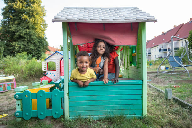 children portrait in a playhouse children have fun in a playhouse kids play house stock pictures, royalty-free photos & images