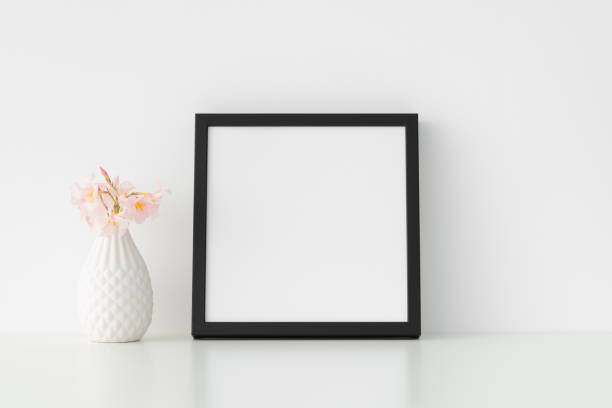 istock Black square frame mockup with pink oleander in a vase. 1267493495
