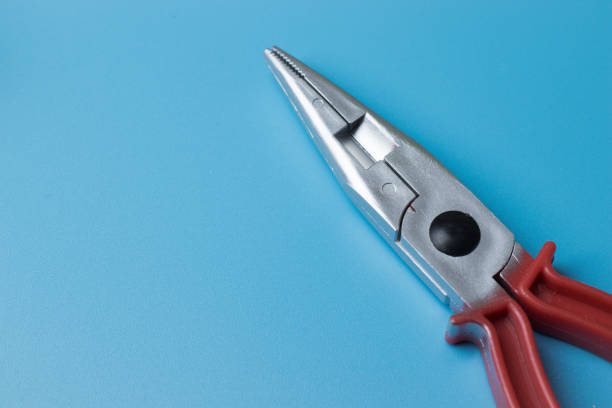 Repair tool close-up on blue background with copy space.
