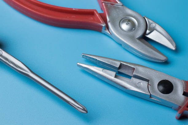 istock Home repair tools flat lay on blue background above view 1267494572