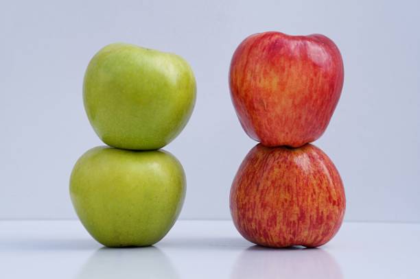 istock Red apples and green apples on white background. 1267495462