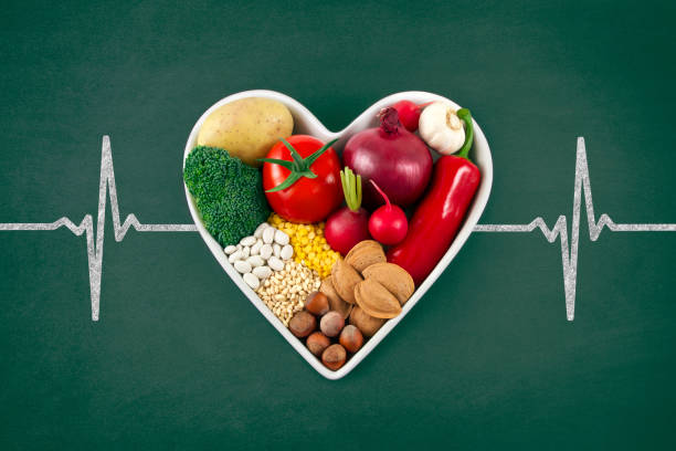 istock Vegetables in Heart Shaped Bowl on Green Chalkboard 1267495806