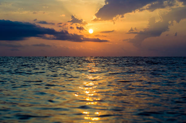 istock Amazing sea sunset, the sun, waves, clouds 1267497349