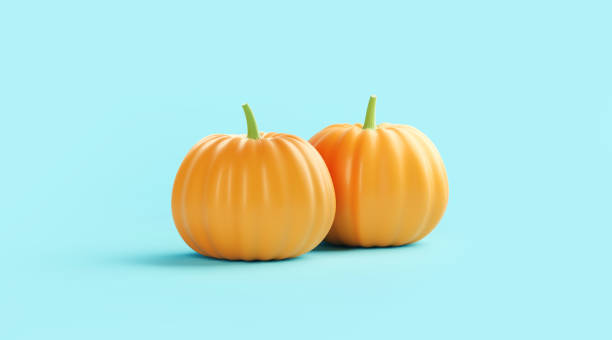 istock Pumpkins Sitting on Turquoise Background 1267497686