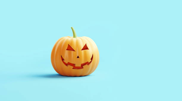 istock Jack O' Lantern Sitting on Turquoise Background 1267497715
