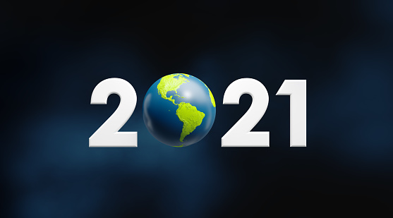 2021 written by numbers and sphere textured with world map. Horizontal composition with copy space.