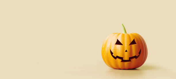 istock Jack O' Lantern Sitting on Beige Background 1267498815