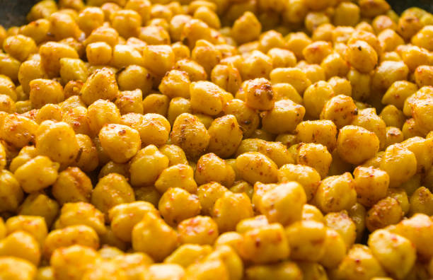 istock Cooking chickpeas with spices in a pan, close-up 1267499232