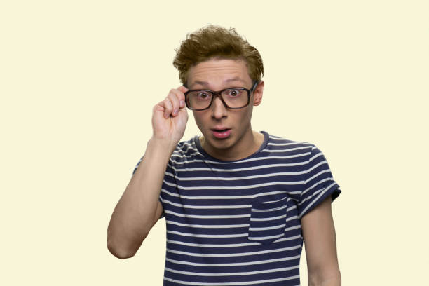 istock Surprised teen boy touching the spectacles. 1267500817