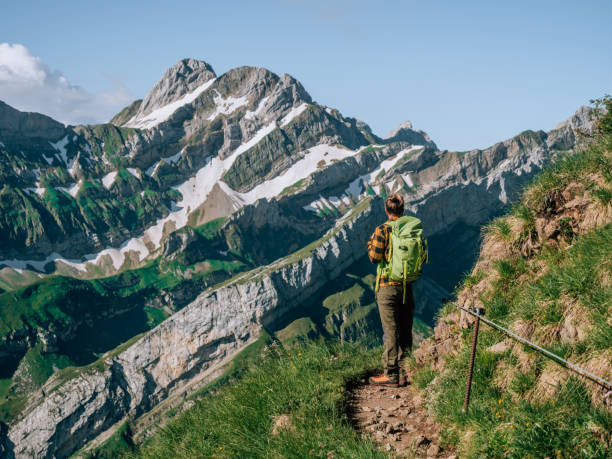 istock Man hikes in the Swiss Alps 1267504889