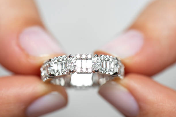 istock Woman Holding A Diamond Ring 1267505244