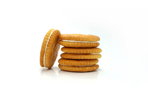 istock Close-Up Of Biscuits Against White Background 1267506825