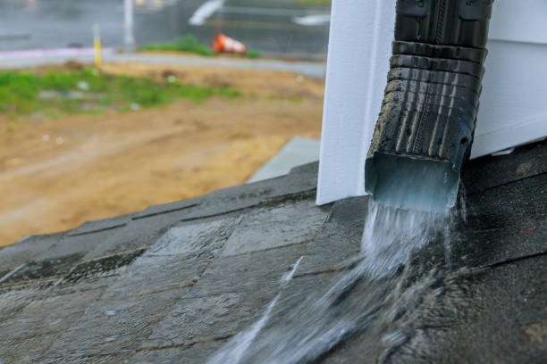 istock Heavy rain during the rainy season causing with water during heavy rain to flow down the roof. 1267510157