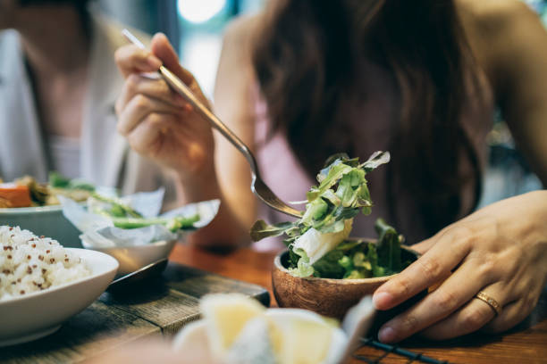 istock Asian woman eating breakfast 1267510651