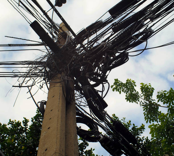istock Confusing and Messed-up Electricity cables of Electricity pole 1267511301