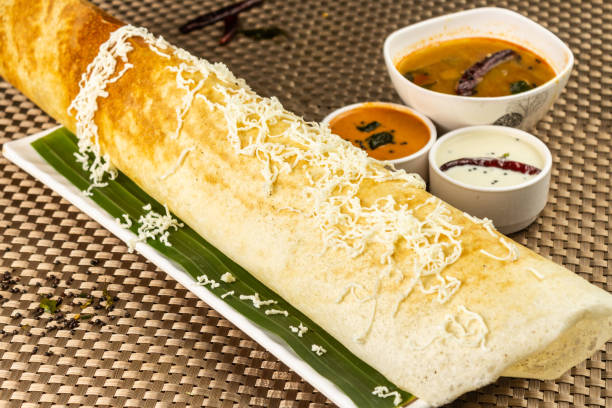 Cheese plain dosa Cheese plain dosa famous south Indian breakfast crepes with cheese potato filling, selective focus thosai stock pictures, royalty-free photos & images