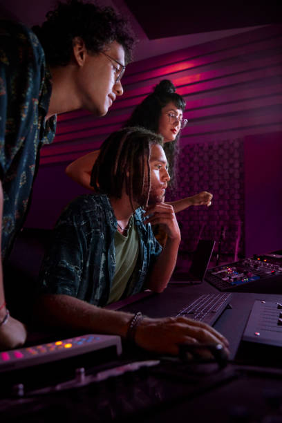istock Alternative musicians working on song in music studio 1267511677