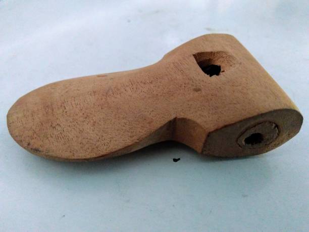 a wooden whistle on the table