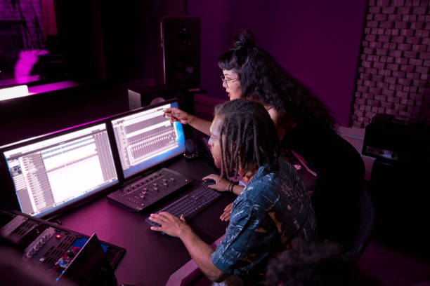 Top 10 Music Production Software for Beginners 13 mixed race female artist working with african american music producer on her song in music