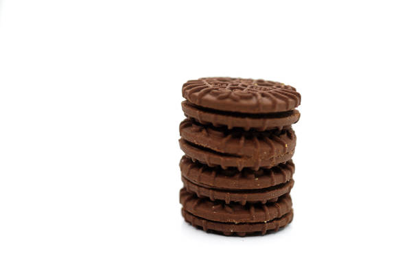 istock Close-Up Stack Of Chocolate Cookies Against White Background 1267513125