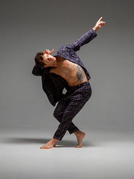 istock Cool young stylish guy dancer in suit dancing hip-hop. Dance school poster. Dance lessons 1267513367