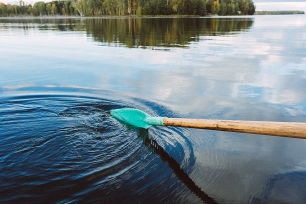 istock Long paddle on the water in the autumn lake 1267513373