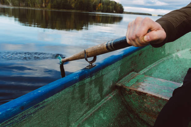 Long paddle on the water in the autumn lake