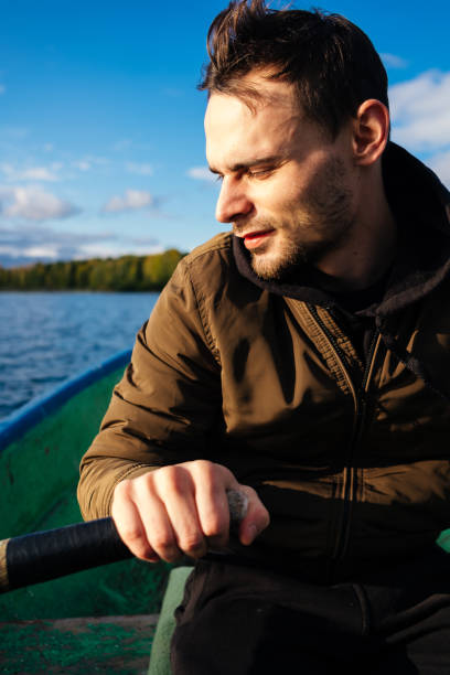 istock A man rowing on oars on an autumn lake 1267513447
